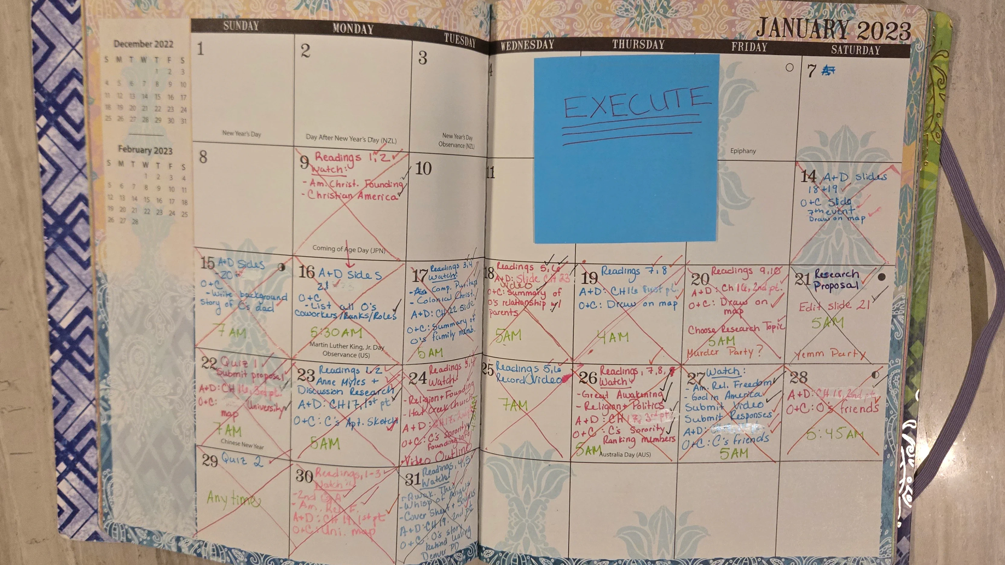 Monthly planner and gel pens used to plan Target of Opportunity